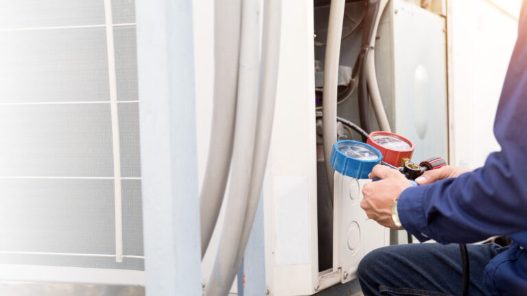 Technician Is Checking Air Conditioner ,measuring Equipment For Filling Air Conditioners.