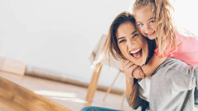 mother and daughter being playful and laughing