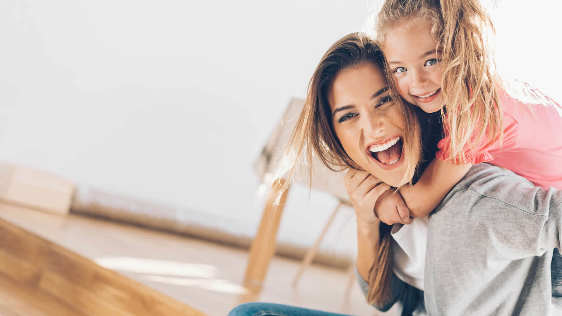 mother and daughter being playful and laughing