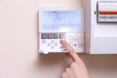 Programmable thermostat on a wall in a home