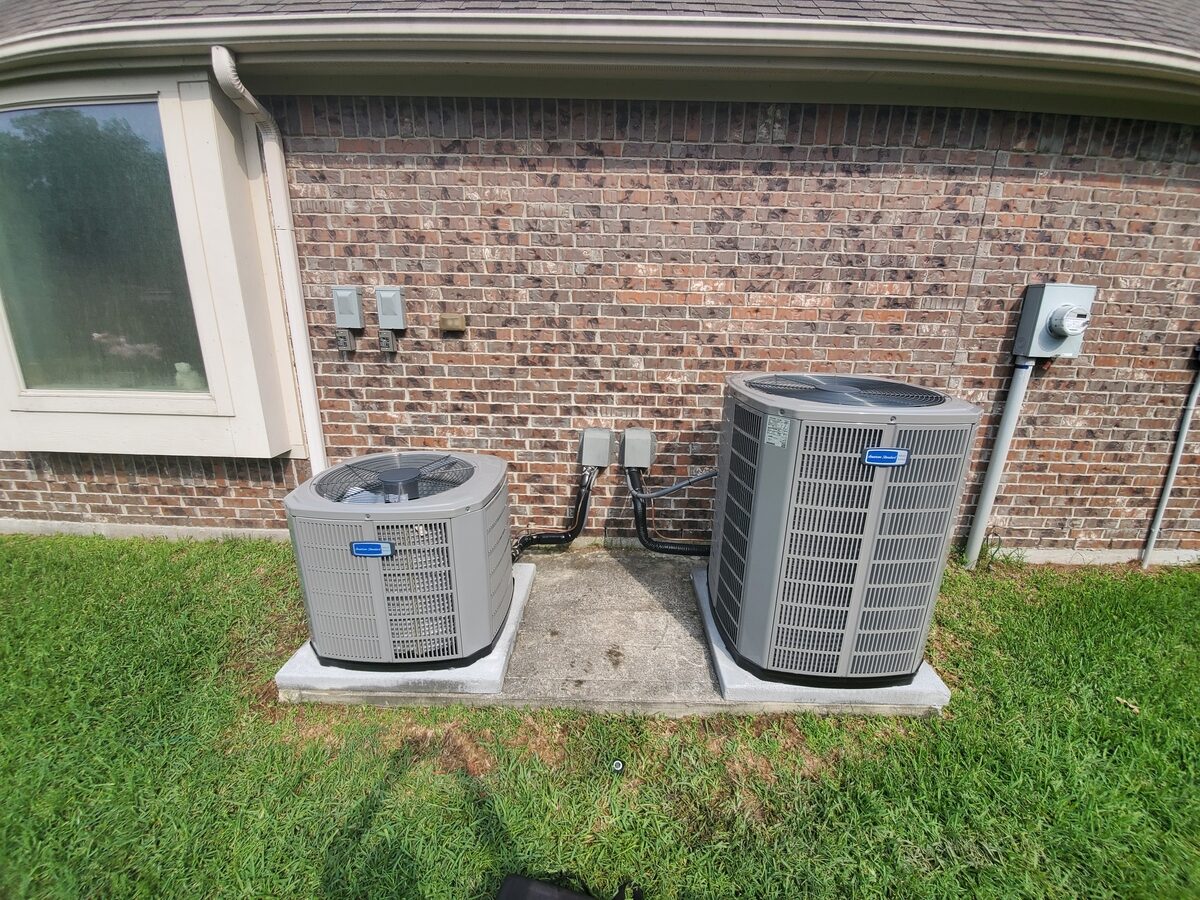 Outdoor air conditioning unit beside a residential home