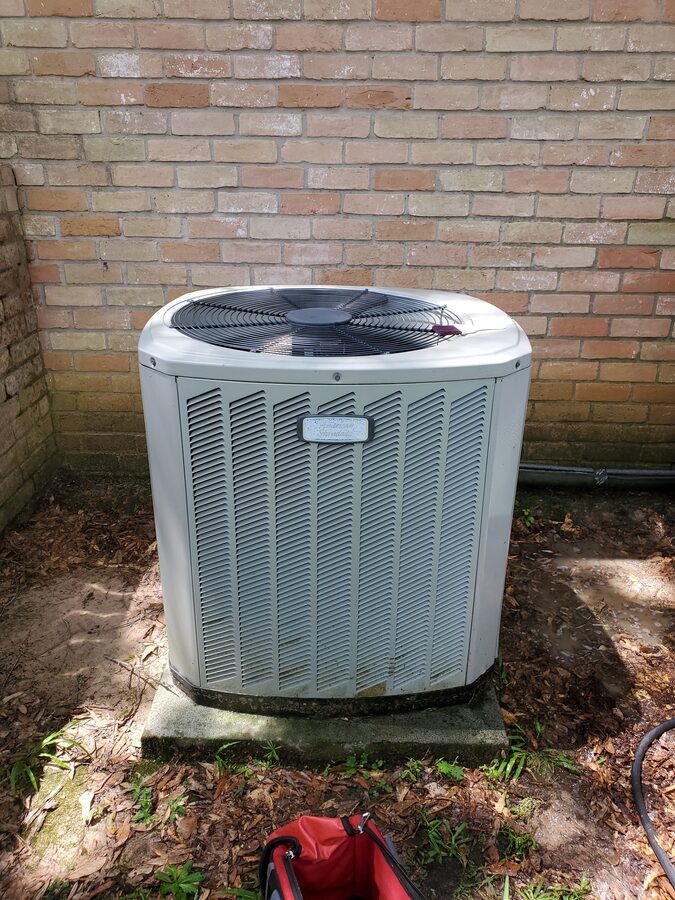 Outdoor HVAC thermostat mounted on a wall