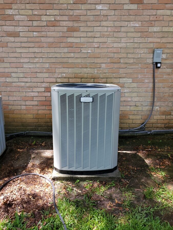 Outdoor HVAC condenser near a residential property